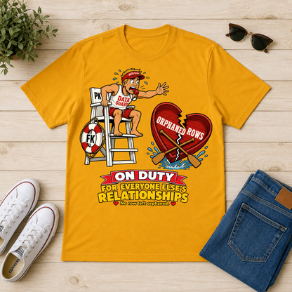 A yellow graphic t-shirt laid flat on a light wood surface, surrounded by lifestyle props including white sneakers, sunglasses, a small plant, and folded blue jeans. The t-shirt features a cartoon lifeguard with a broken red heart that reads 'ORPHANED ROWS' and the text 'ON DUTY FOR EVERYONE ELSE'S RELATIONSHIPS'.